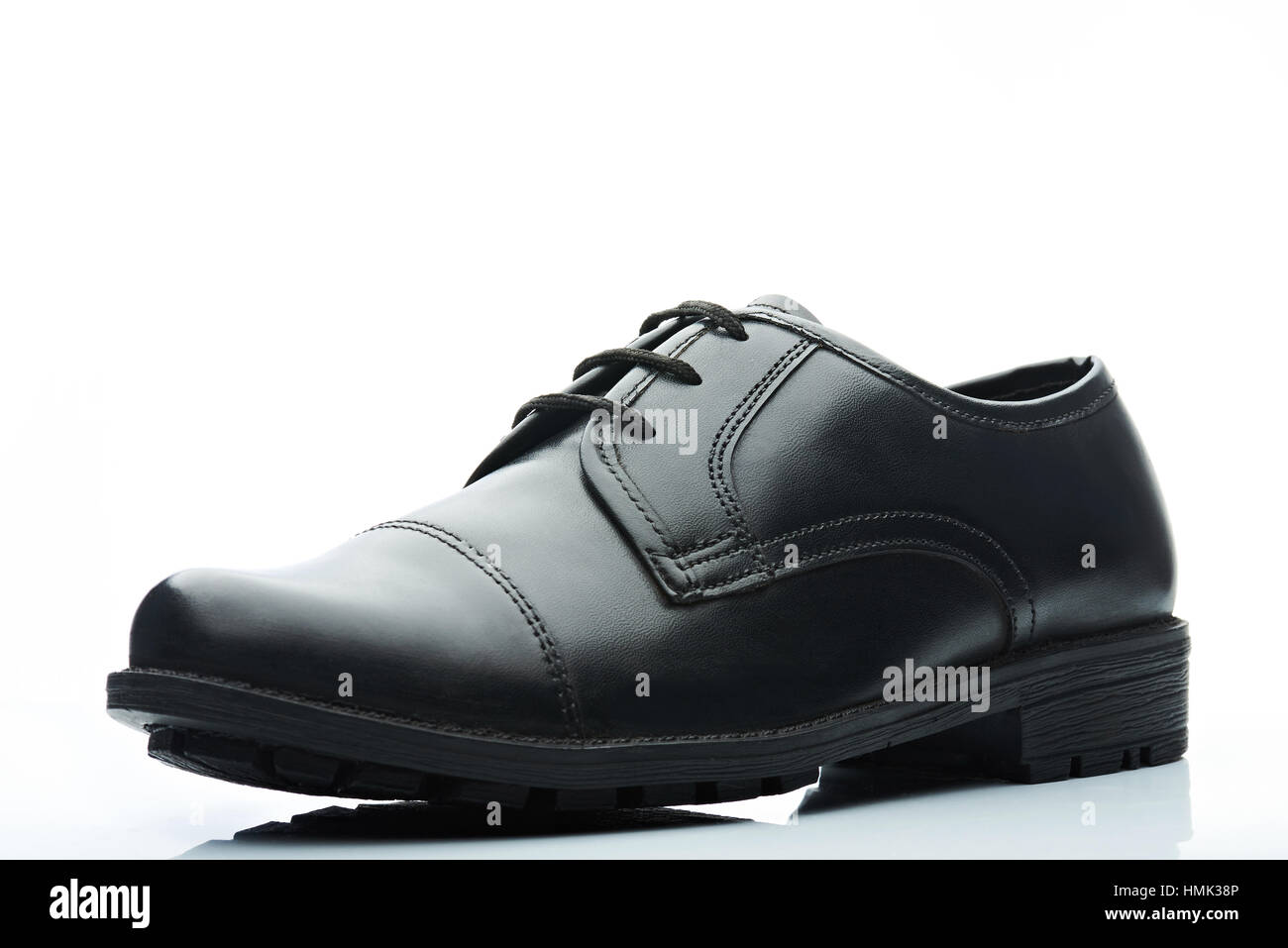 black men leather shoe on white background Stock Photo - Alamy