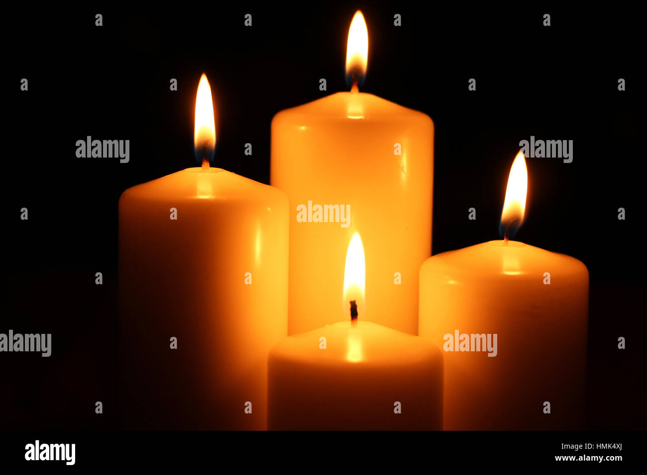 four candle darkness fire Stock Photo