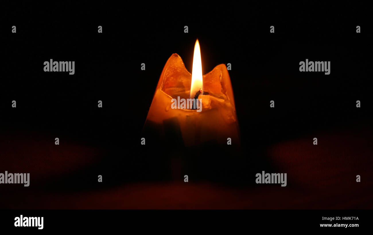 pyramidal candle burns down Stock Photo Alamy