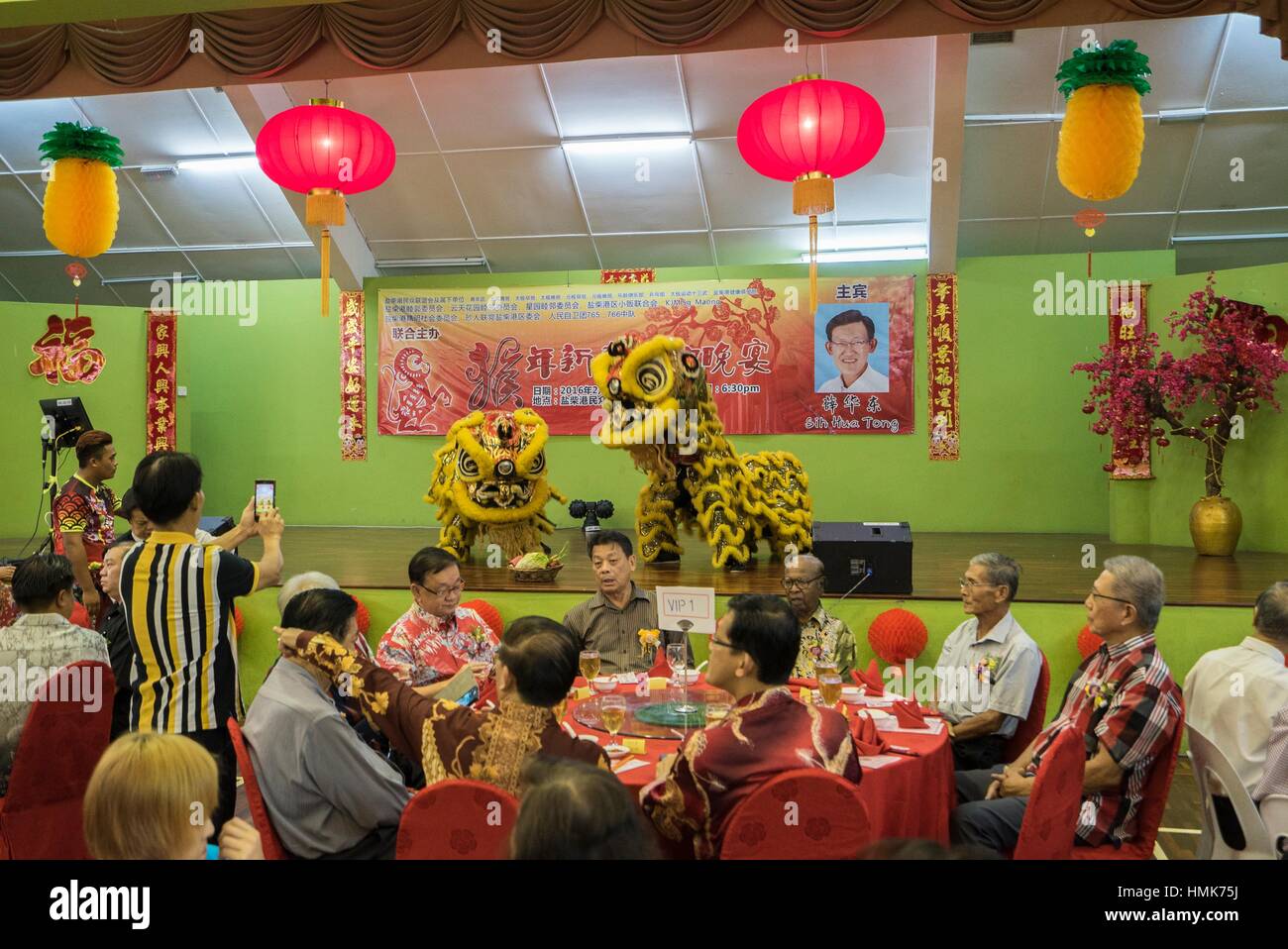 Lion dance at Chinese New Year dinner at Sungai Maong Community Hall, Kuching, Sarawak, Malaysia. Stock Photo