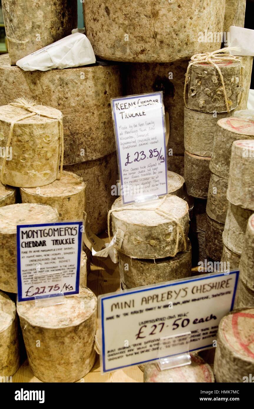 Pile of different types of cheeses on a cheese store, Borought Market