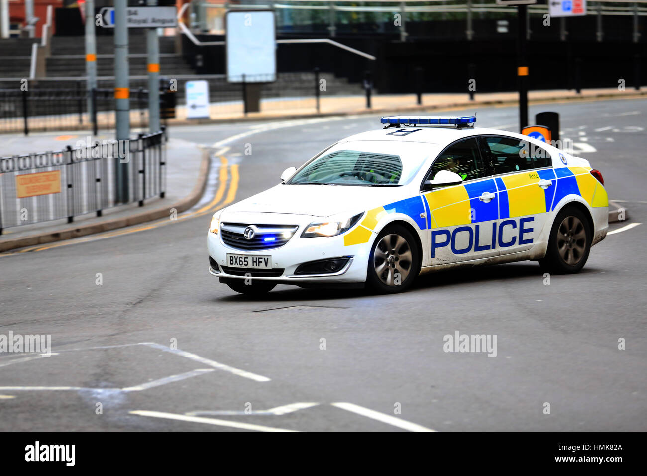 A West Midlands police patrol car in Birmingham city centre responding to an emergency Stock Photo