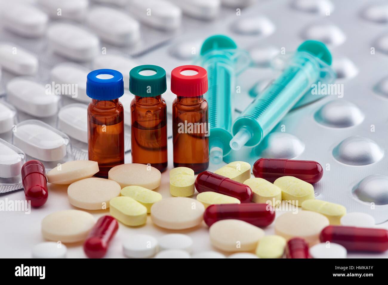 Pharmaceutical medicines, pills, capsules, vials and syringe Stock Photo