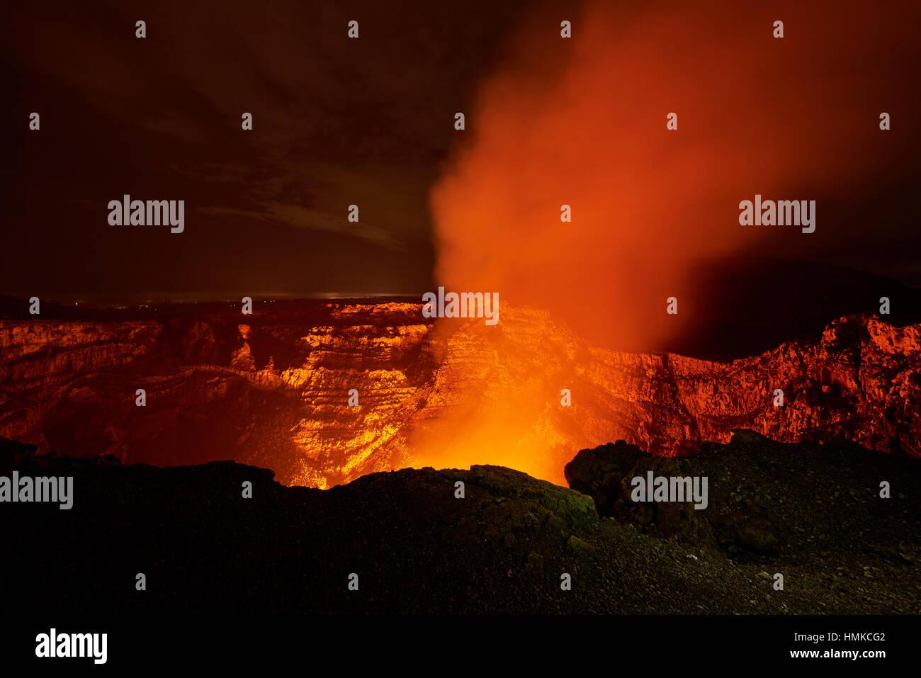 big crater of volcano with lava glow and smoke Stock Photo - Alamy