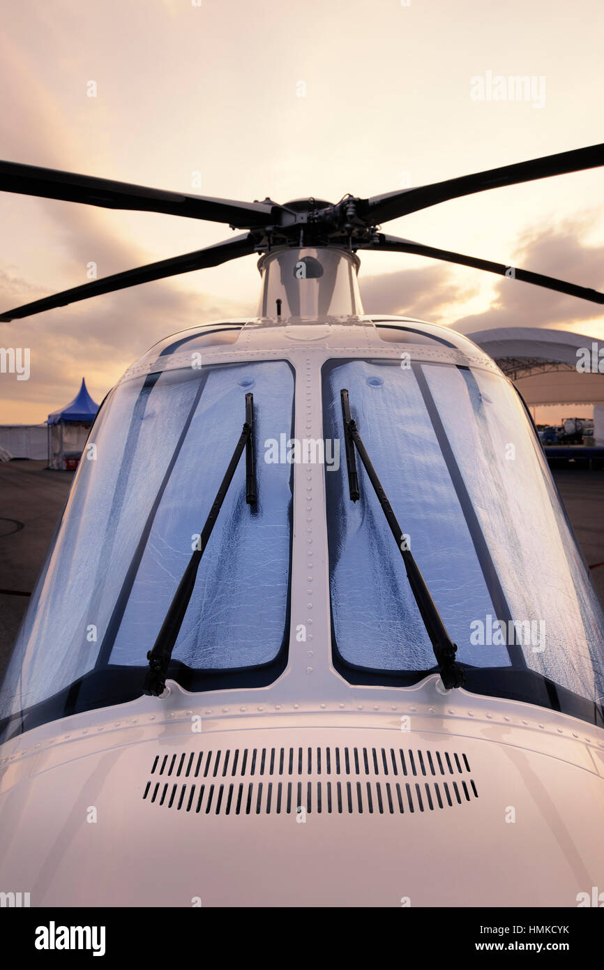windshield of Susi VIP Agusta A-109S Grand parked in the static-display at the Singapore-Airshow 2010 Stock Photo