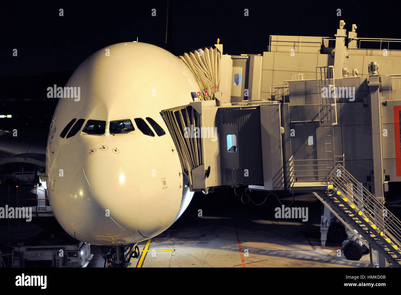 a Singapore Airlines SIA Airbus A380-800 parked at night at Terminal3 Singapore Changi Stock Photo