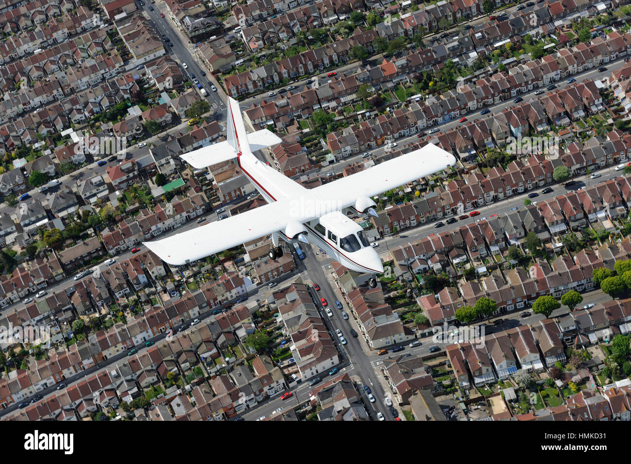 Australian Queensland Police Britten Norman BN-2B-20 Islander flying over streets of houses in Portsmouth Stock Photo