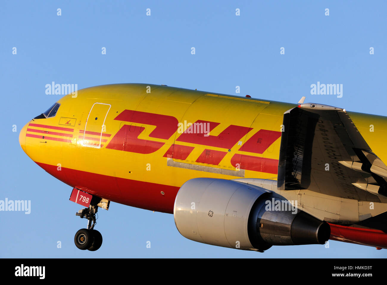 nose and General Electric CF6-80 engine-cowling of DHL Airways Boeing 767-200 freighter taking-off Stock Photo
