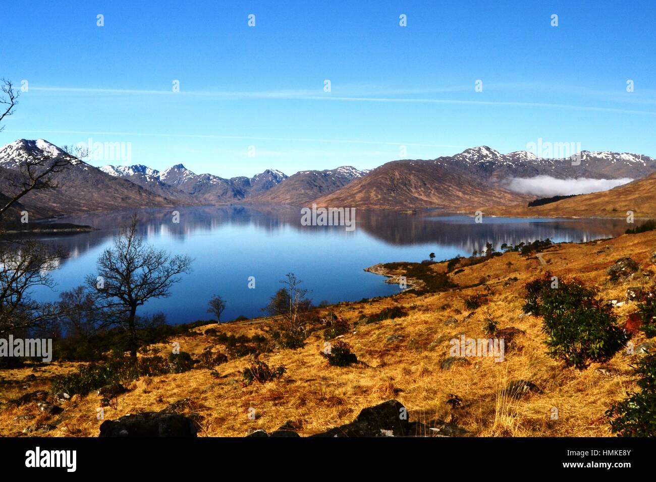 Loch Quoich on a clear spring day with the mountains of Knoydart in the distance Stock Photo