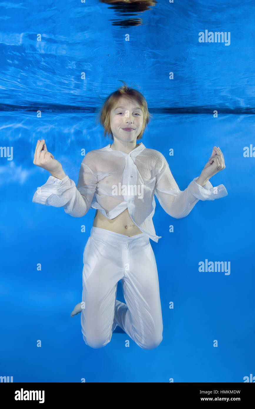 Illusie Handig betreuren Play fashion junior" - Boy in a white shirt and trousers poses underwater,  Odessa, Ukraine Stock Photo - Alamy