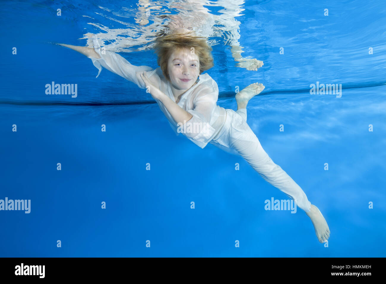 Illusie Handig betreuren Play fashion junior" - Boy in a white shirt and trousers poses underwater,  Odessa, Ukraine Stock Photo - Alamy