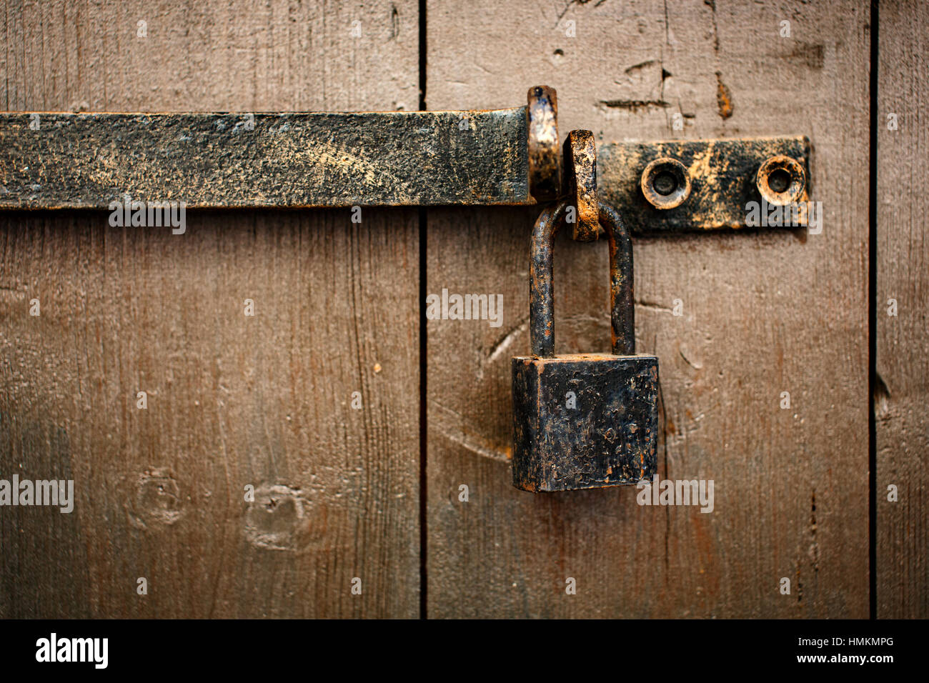 Old rusty aged padlock on the door outside Stock Photo Alamy