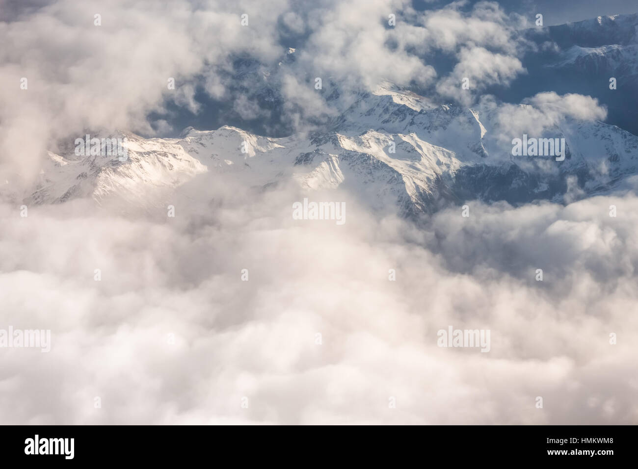 Aerial view of snowy mountains and clouds Stock Photo - Alamy