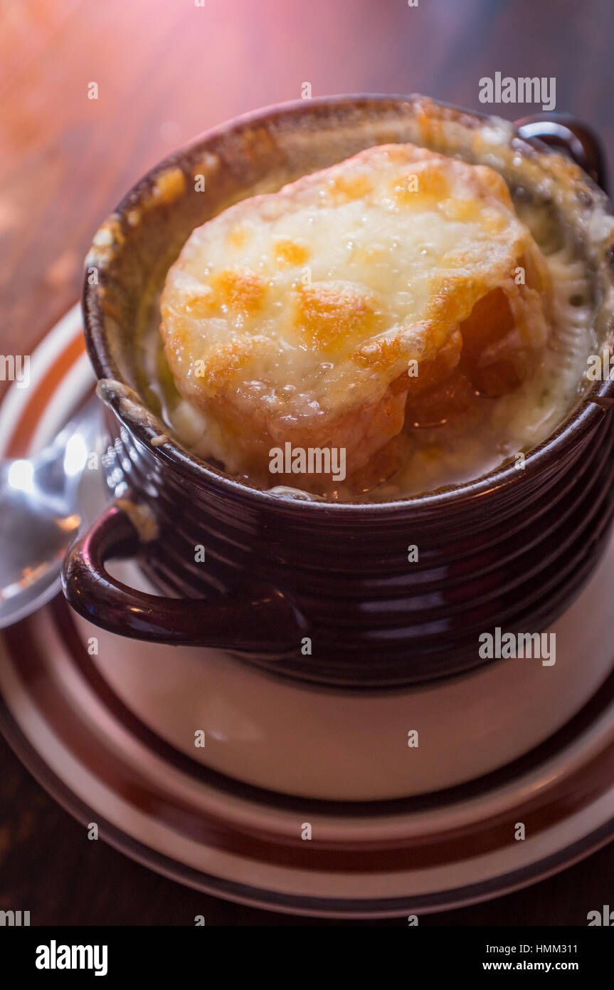 French onion soup with crispy gruyere cheese over toast Stock Photo - Alamy