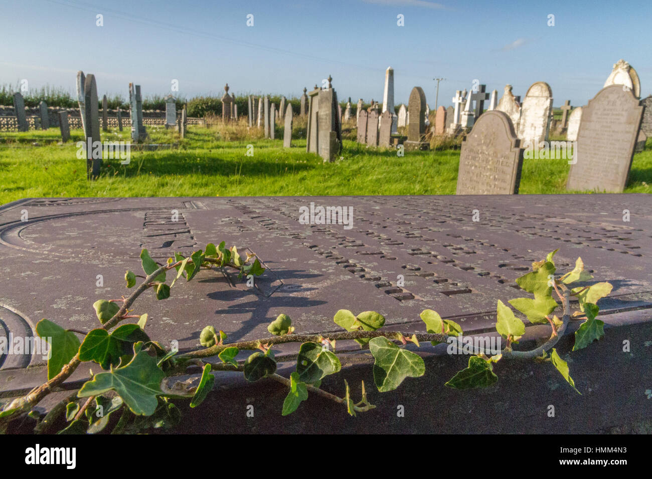 Welsh church graveyard with many gravestones. Stock Photo