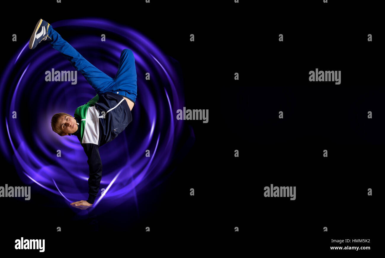 Breakdancer standing on hand Stock Photo - Alamy