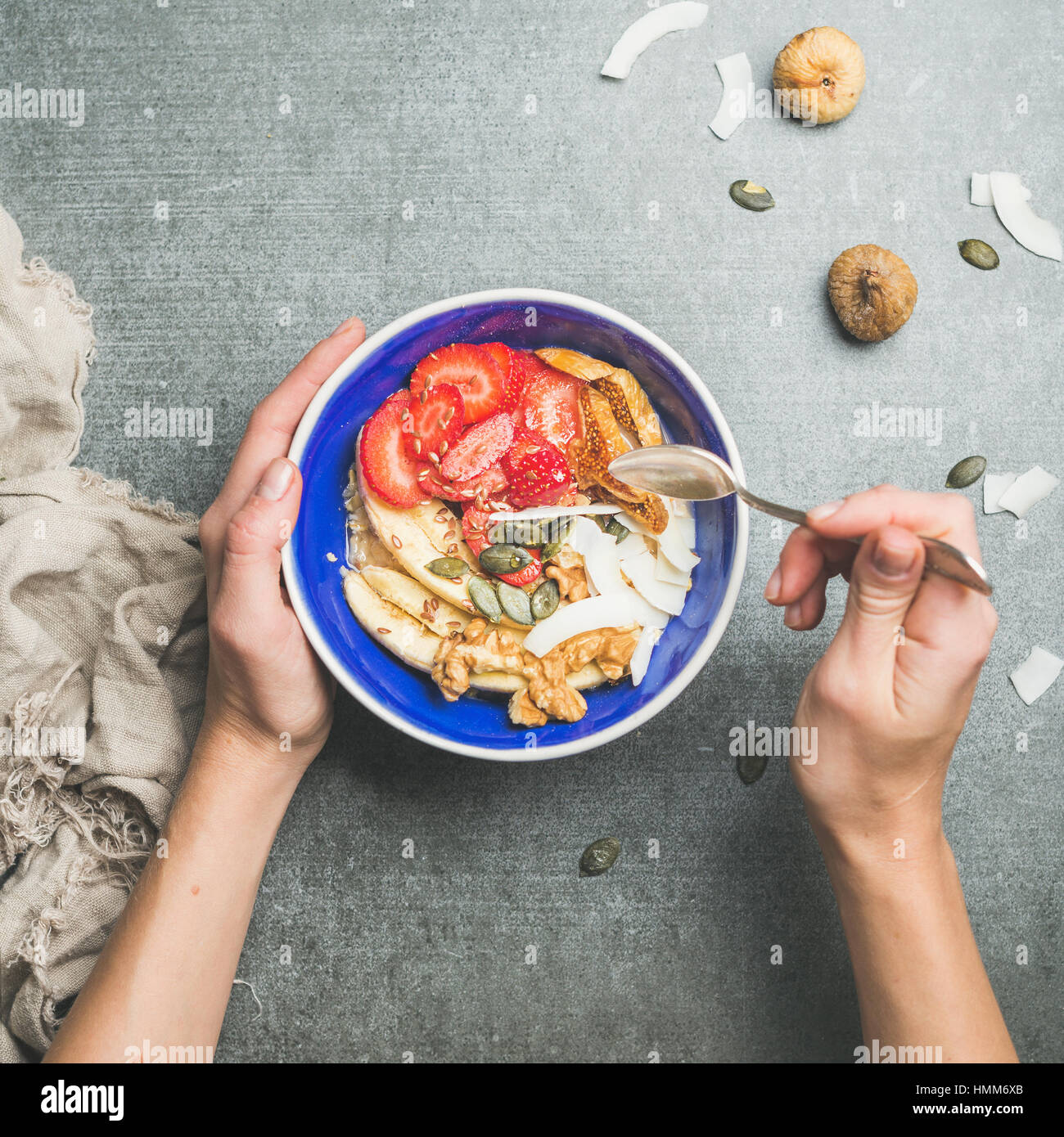 Woman's hands holding blue healthy breakfast bowl Stock Photo