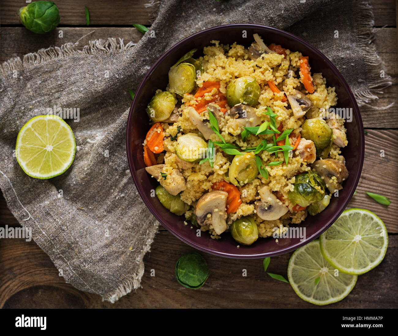 Vegetarian couscous salad with brussels sprouts, mushrooms, carrots and