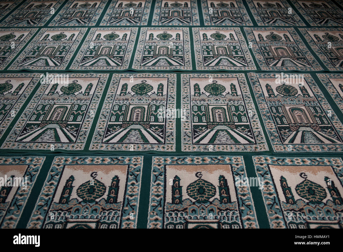 View of Muslim praying carpets inside the Grand Mosque in Medan, Sumatra, Indonesia. Stock Photo