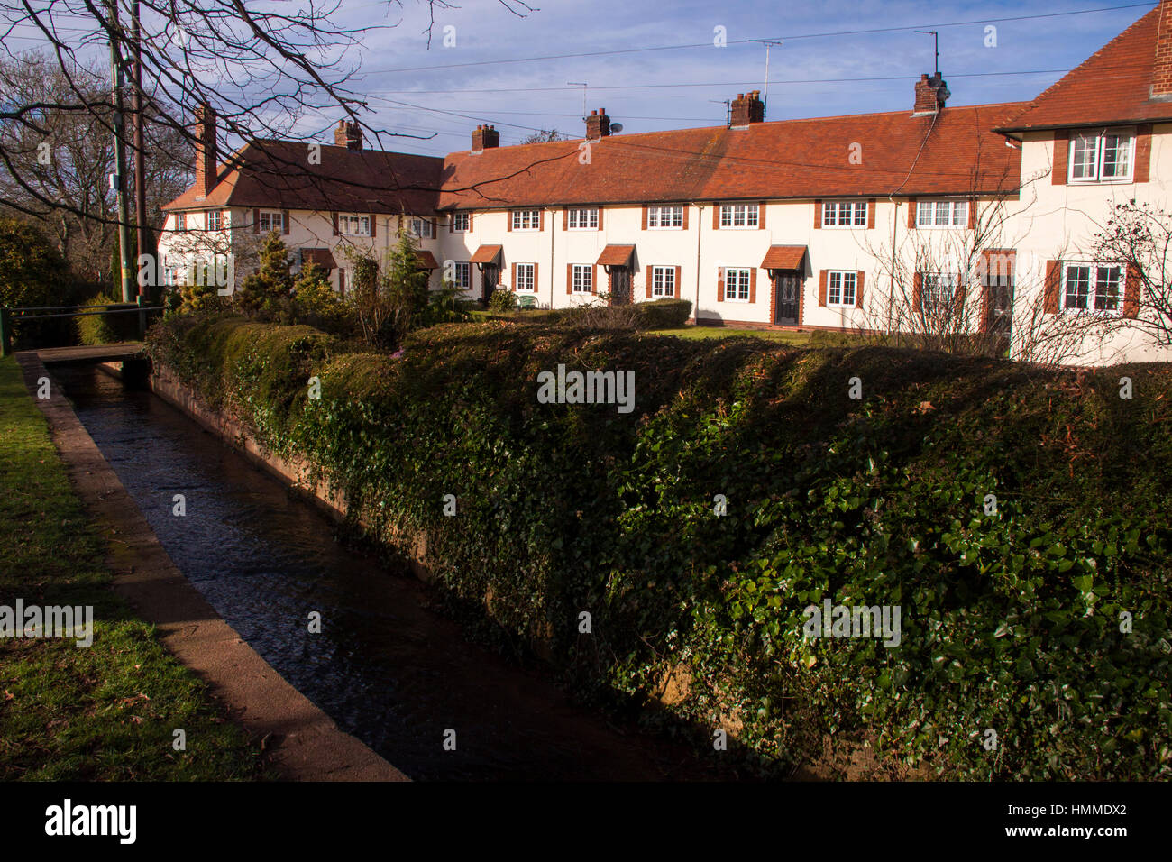 Houses alongside the stream which runs through the pretty village of Otterton, Devon. Stock Photo