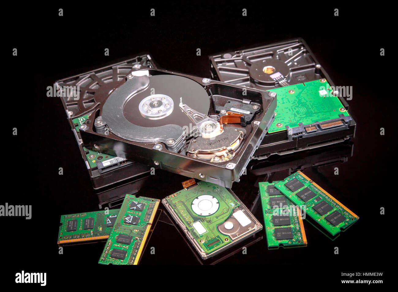 3 full sized hard disks,  1 mini hard disk and 4 laptop memory modules Stock Photo