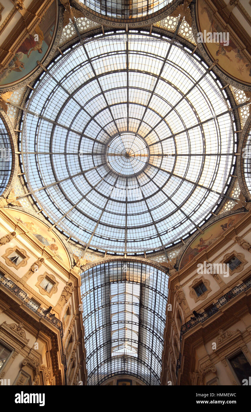 InsideArcade dedicated d to Vittorio Emanuele II King of Italy with a glass roof and steel and artistic decorations in Milan Italy Stock Photo