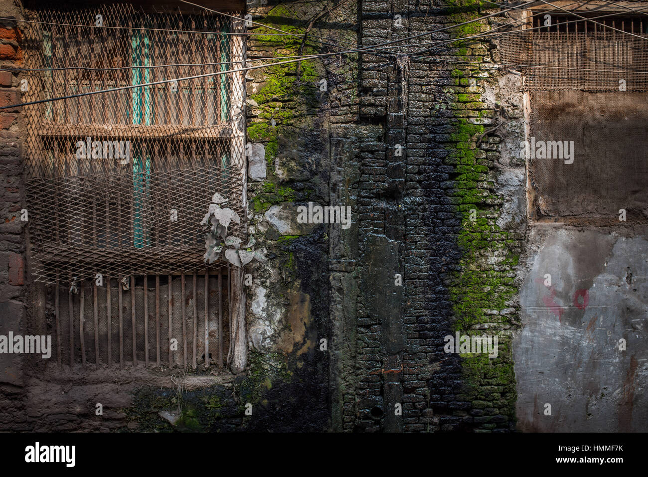 Water running down a wall in old Delhi Stock Photo