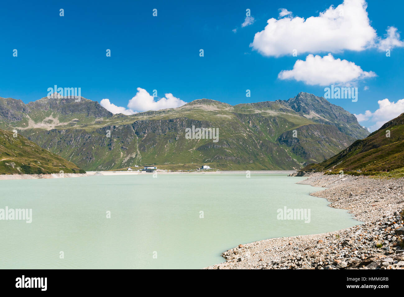 The Silvretta Stausee Reservoir Lake in Summer, Austria with deep blue sky Stock Photo