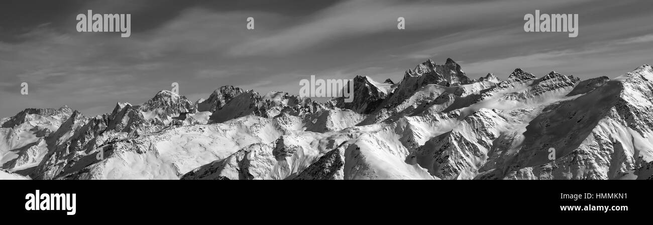 Black and white panorama of winter mountains. Caucasus Mountains. View from ski slope of mount Elbrus. Stock Photo