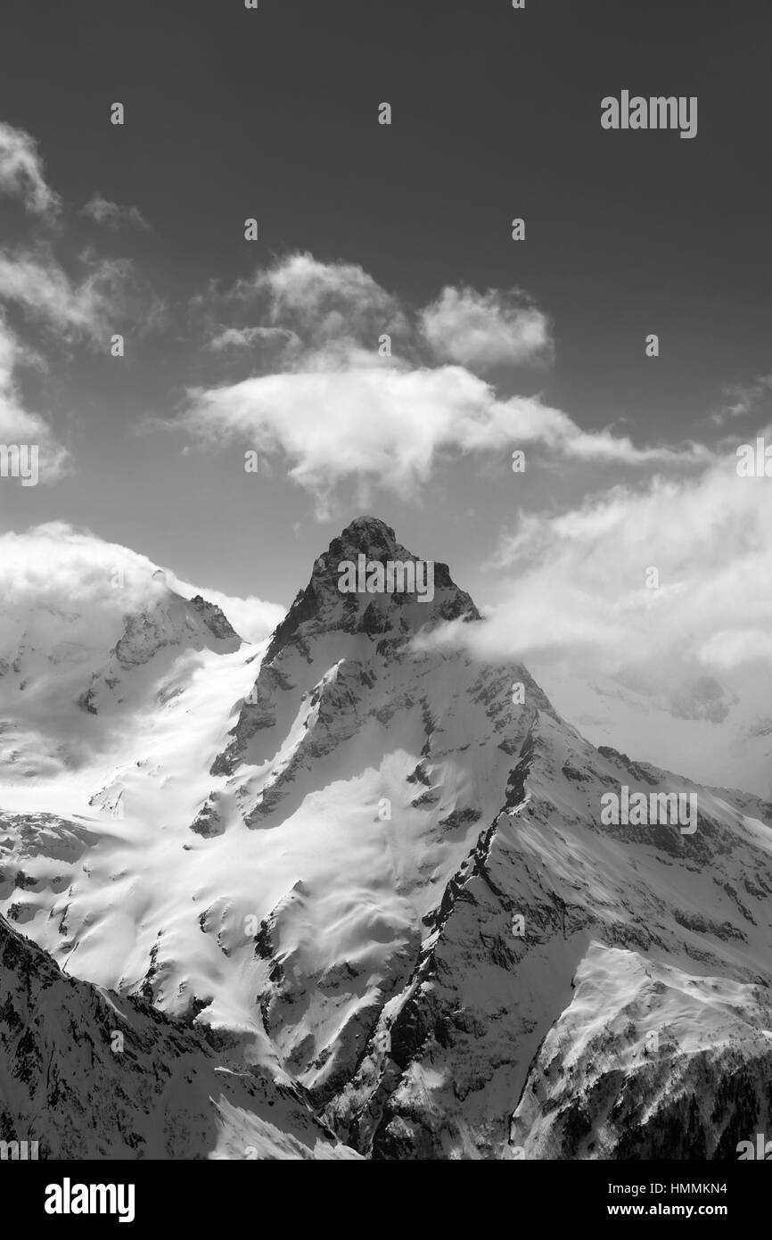 Black and white view on high winter mountains in snow. Caucasus Mountains, region Dombay, Mount Belalakaya. Stock Photo
