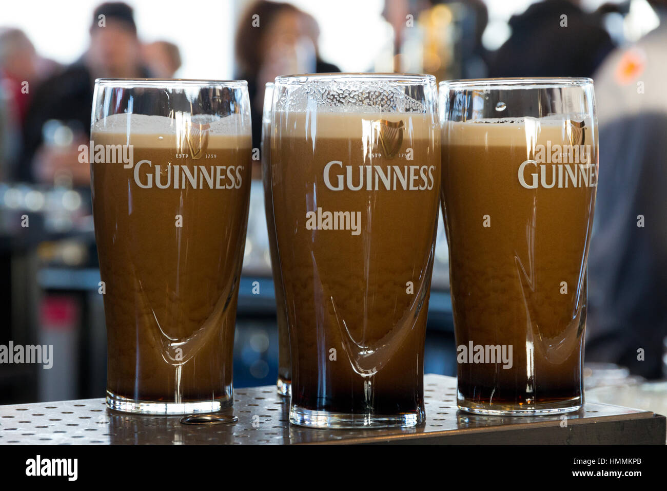 DUBLIN, IRELAND - FEB 15, 2014: Pints of beer are served at the popular ...