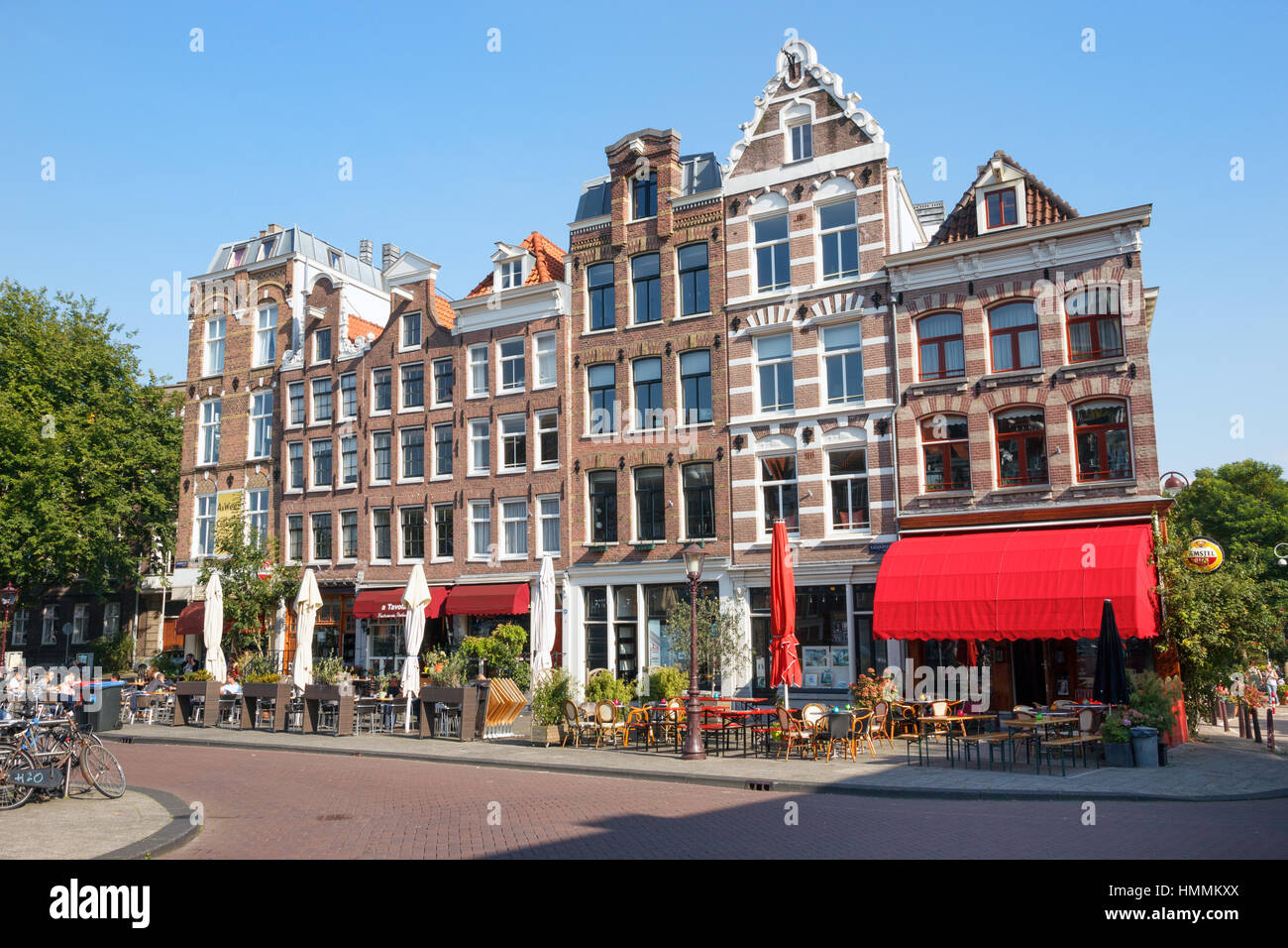 AMSTERDAM - AUG 27, 2014: Restaurants in typical canal houses on the Kadijksplein in Amsterdam Stock Photo