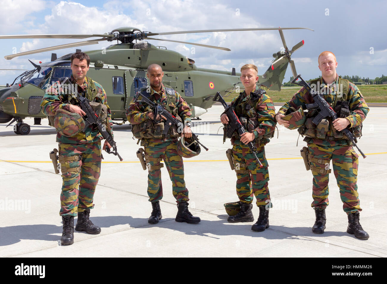 BEAUVECHAIN, BELGIUM - MAY 20, 2015: Belgian army soldiers in front of the new NH90 helicopter during the THPU exercise. THPU is an annual helicopter  Stock Photo