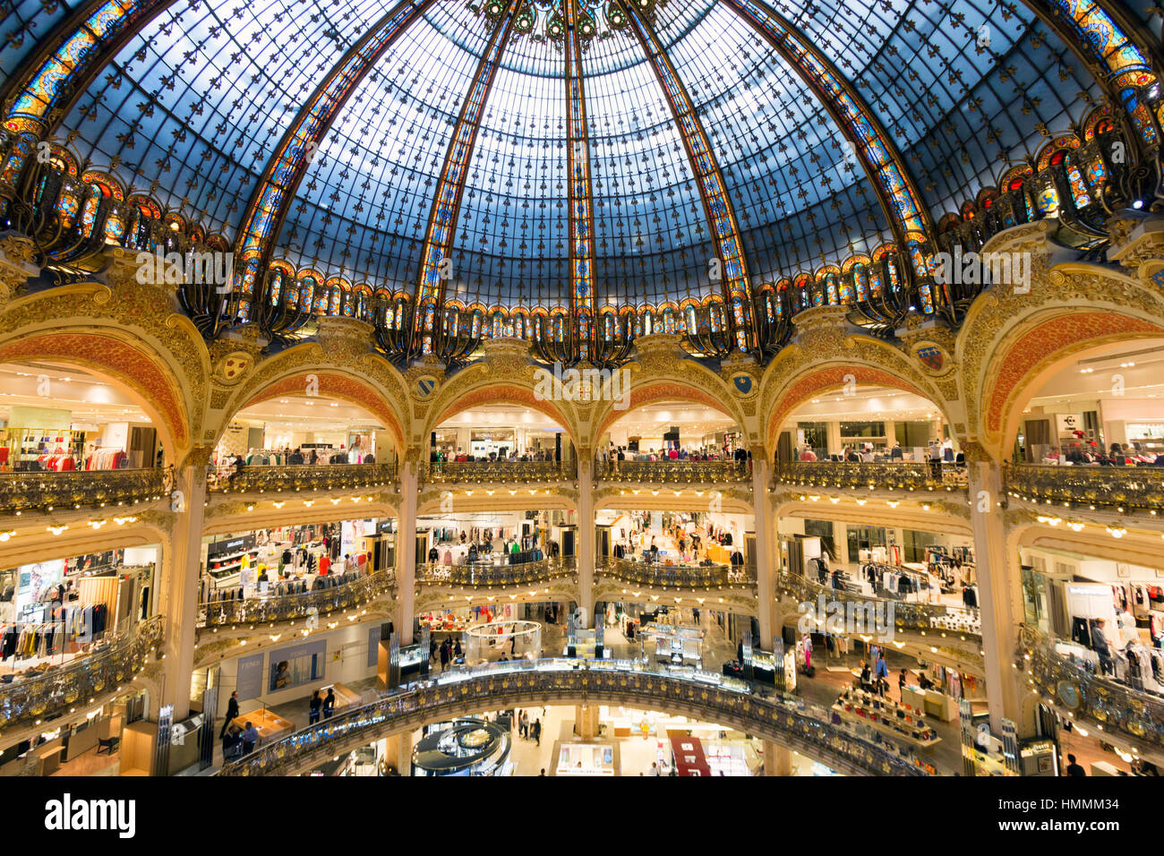 PARIS, FRANCE - JUNE 18, 2015: Interior of the Galeries Lafayette in Paris. The architect Georges Chedanne designed the store where a Art Nouveau glas Stock Photo