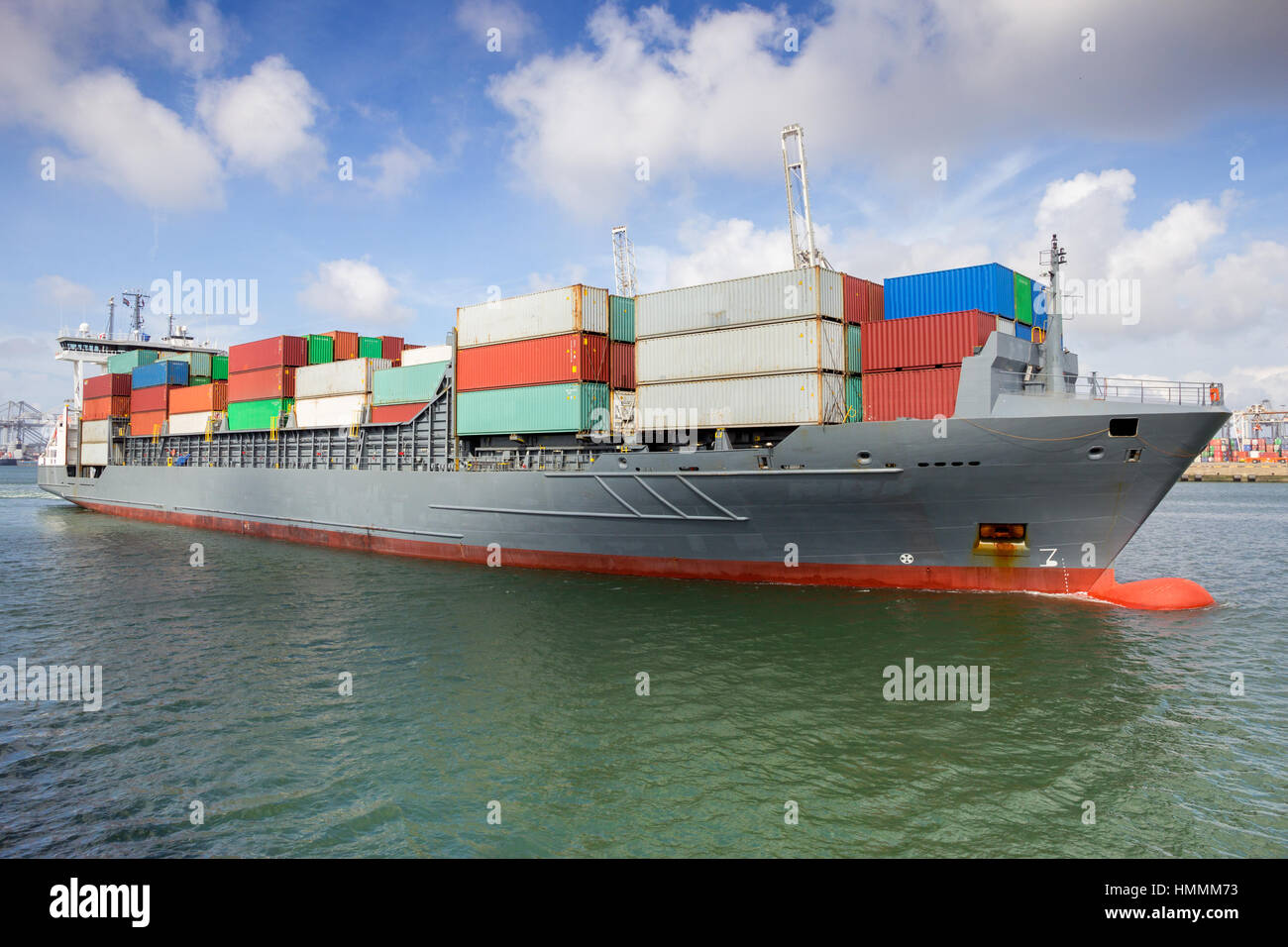 Container ship leaving port Stock Photo
