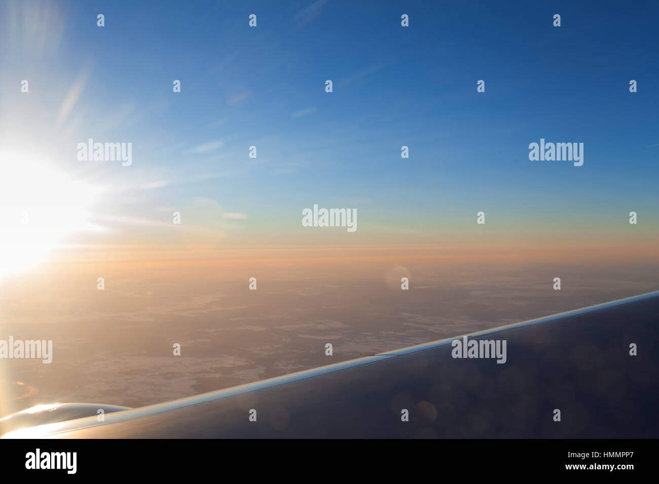 Amazing clouds and the sky as seen through the window of an aircraft ...