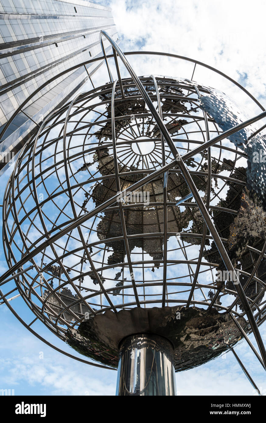 Looking upwards at the Trump International Hotel and Tower and steel unisphere globe at Columbus Circle, New York, USA Stock Photo