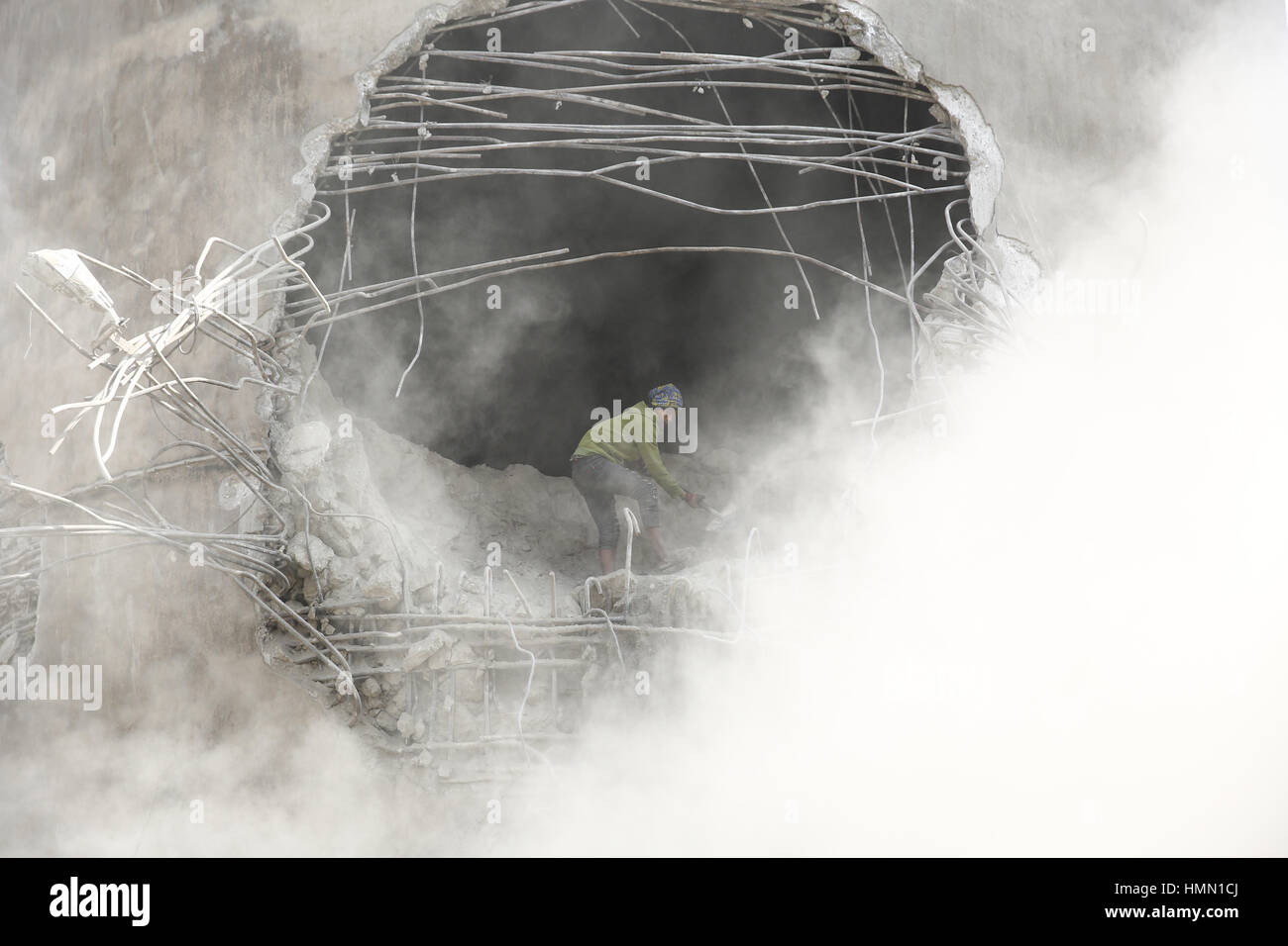 February 4, 2017 - Kirtipur, Nepal - A Nepalese laborer heaves cement from an abandoned cement factory since twenty-years to rebuild a new one in the outskirts of Kathmandu in Nepal on Saturday, February 4, 2017. (Credit Image: © Skanda Gautam via ZUMA Wire) Stock Photo