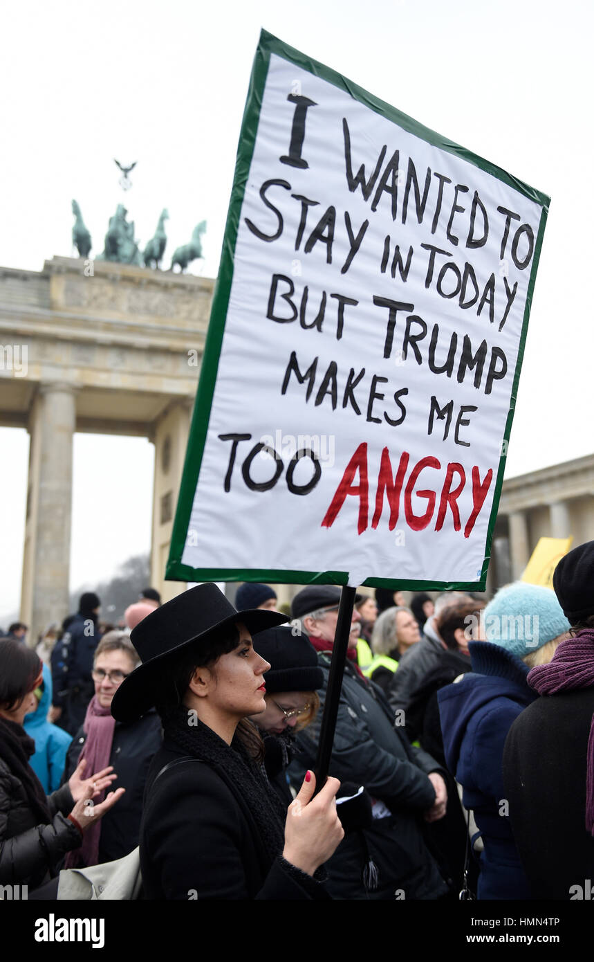 Berlin, Germany. 04th Feb, 2017. Demonstrators holding placards in opposition to US President Trump's travel ban at Pariser Platz in front of the US embassy and Brandenburg Gate in Berlin, Germany, 04 February 2017. Photo: Rainer Jensen/dpa/Alamy Live News Stock Photo