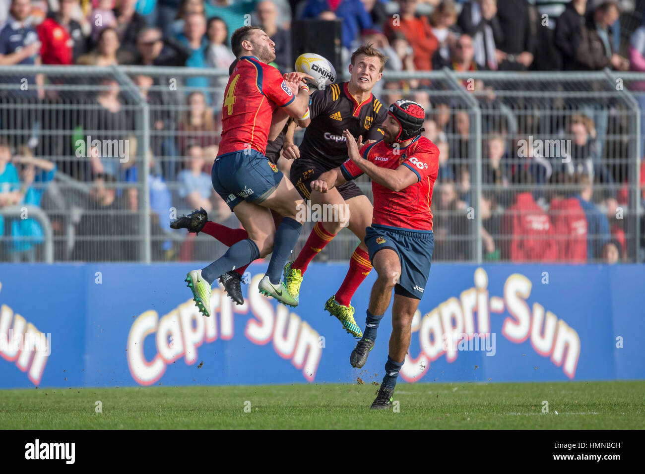 Cologne, Germany. 11th Mar, 2017. Germany's Marcel Coetzee (c) and Spain's David Barrera Howarth (l) and Mathieu Belie in action during the European Rugby Championship Division 1A match between Germany and Spain in Cologne, Germany, 11 March 2017. Photo: Jürgen Keßler/dpa/Alamy Live News Stock Photo