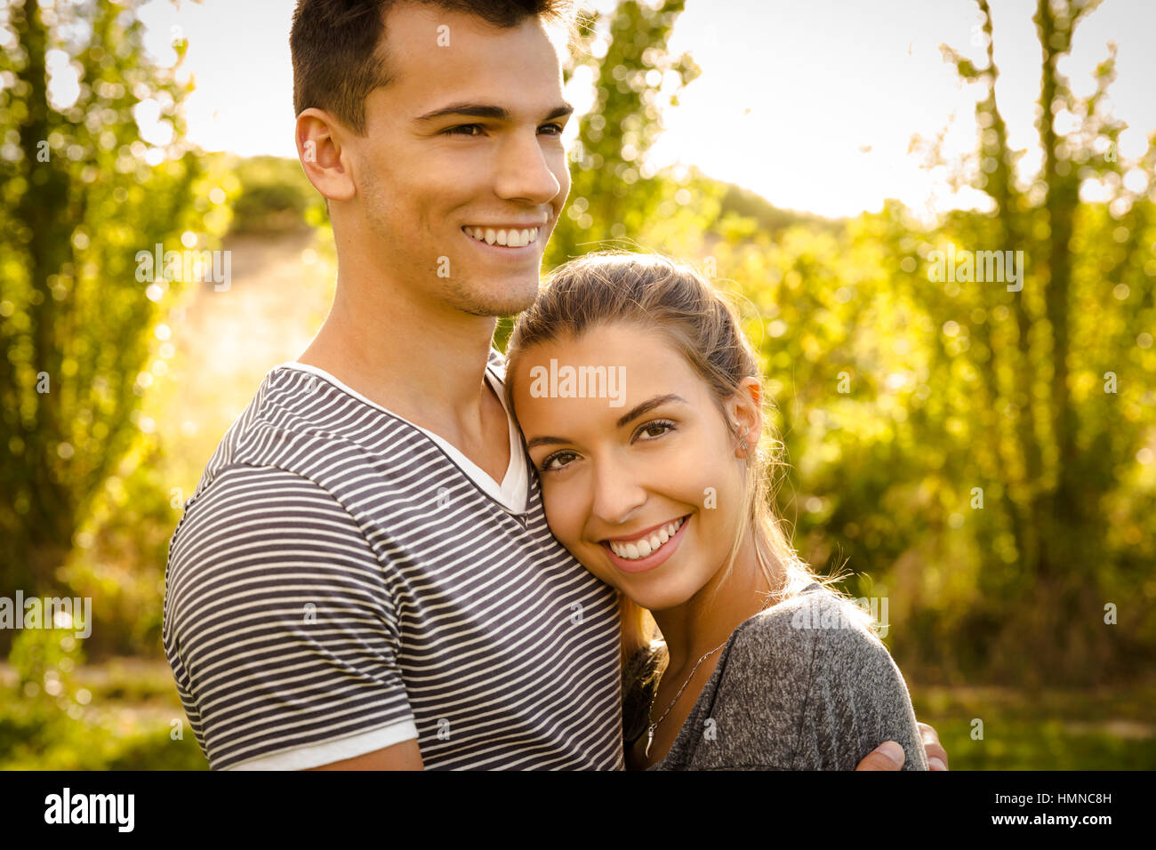Portrait of a happy young couple in love Stock Photo - Alamy