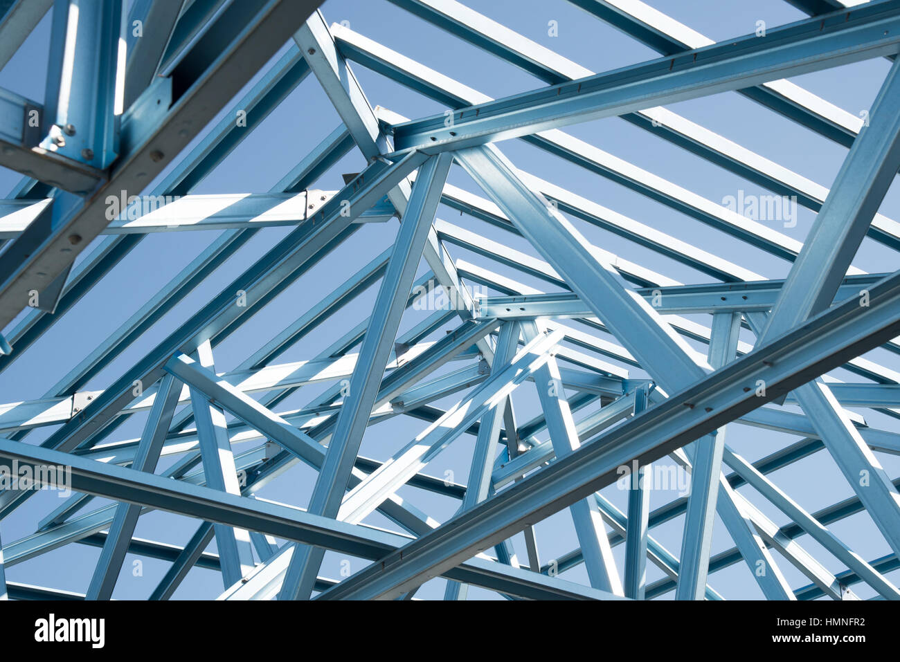 Structure of steel roof frame for building construction on sky ...