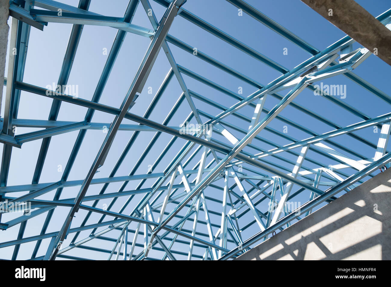 Structure of steel roof frame for building construction on sky ...