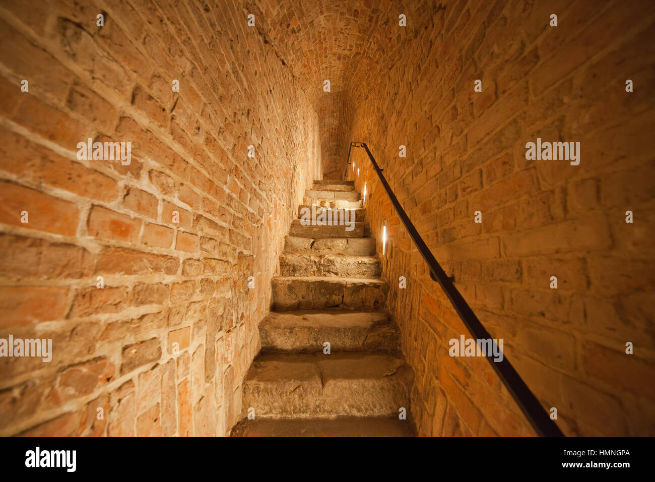 Narrow staircase old brick arched long corridor in Royal Castle of Warsaw in Poland, Europe Stock Photo