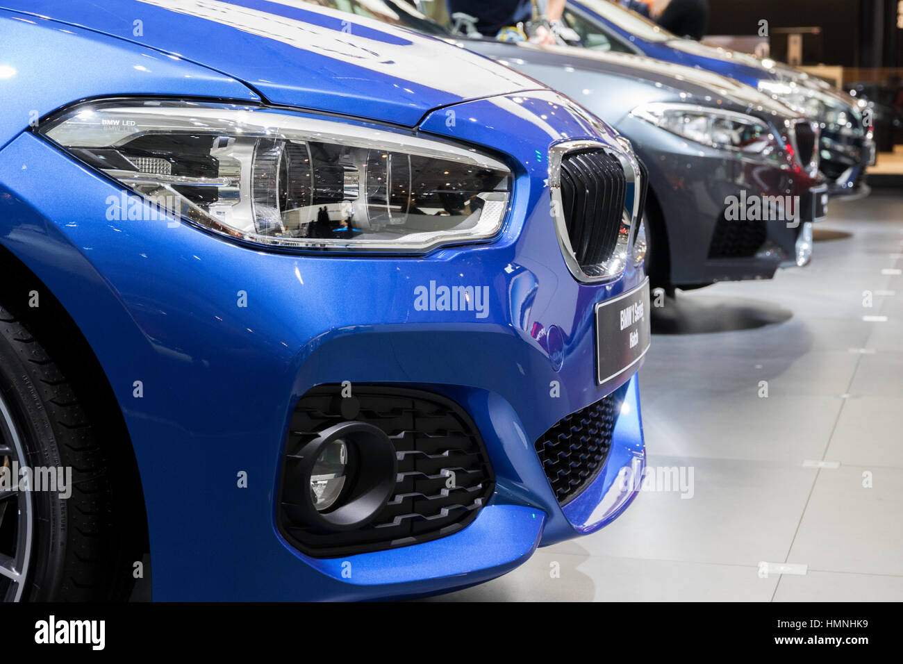 BRUSSELS - JAN 19, 2017: Row of new BMW cars on display at the Motor Show Brussels. Stock Photo