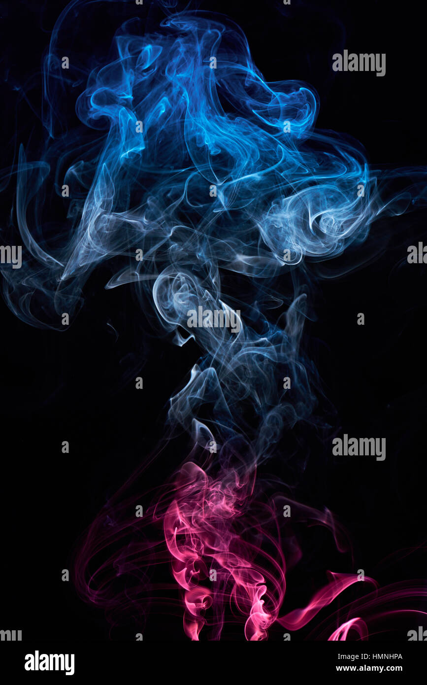curly colored cloud of smoke isolated on black Stock Photo