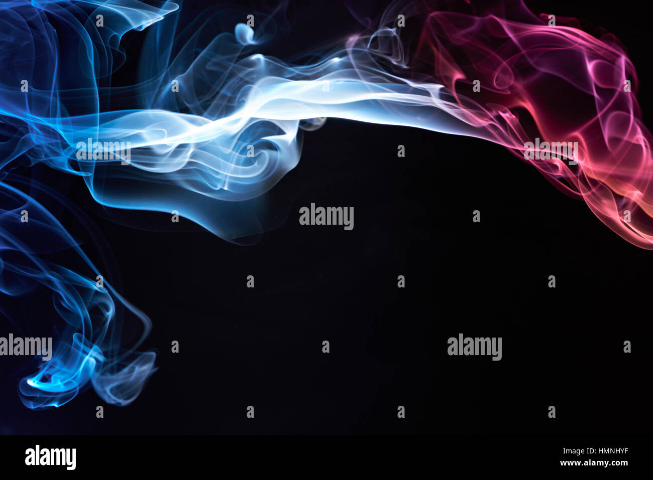 smoke colorful curves isolated on black background Stock Photo