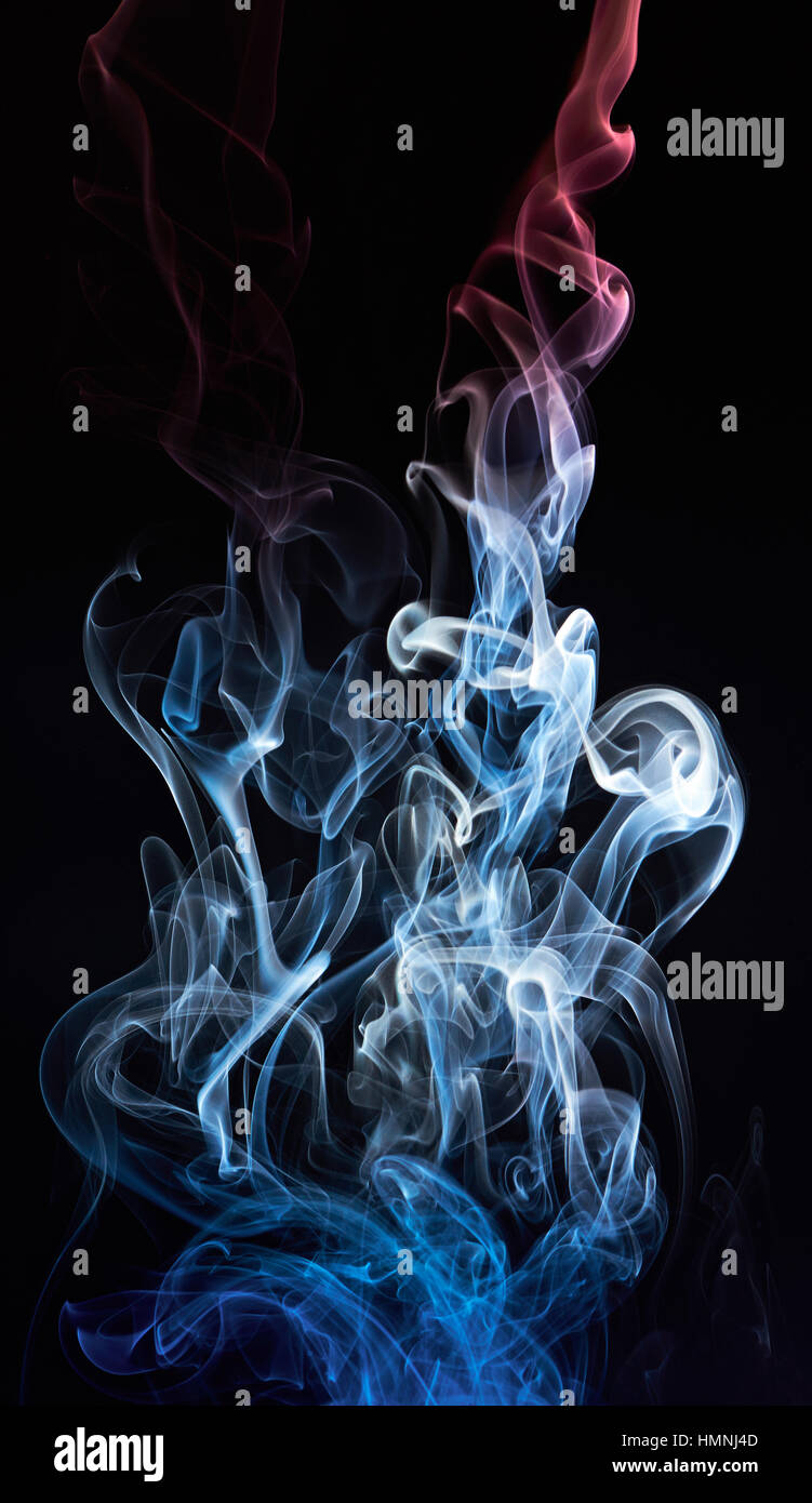 abstract colored swirl on smoke cloud isolated on black Stock Photo