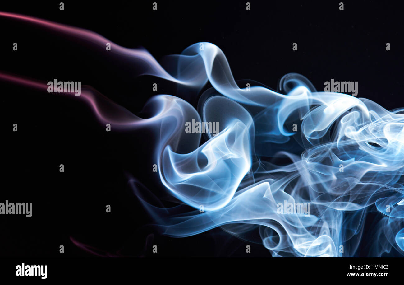 abstract colored smoke background isolated on black Stock Photo