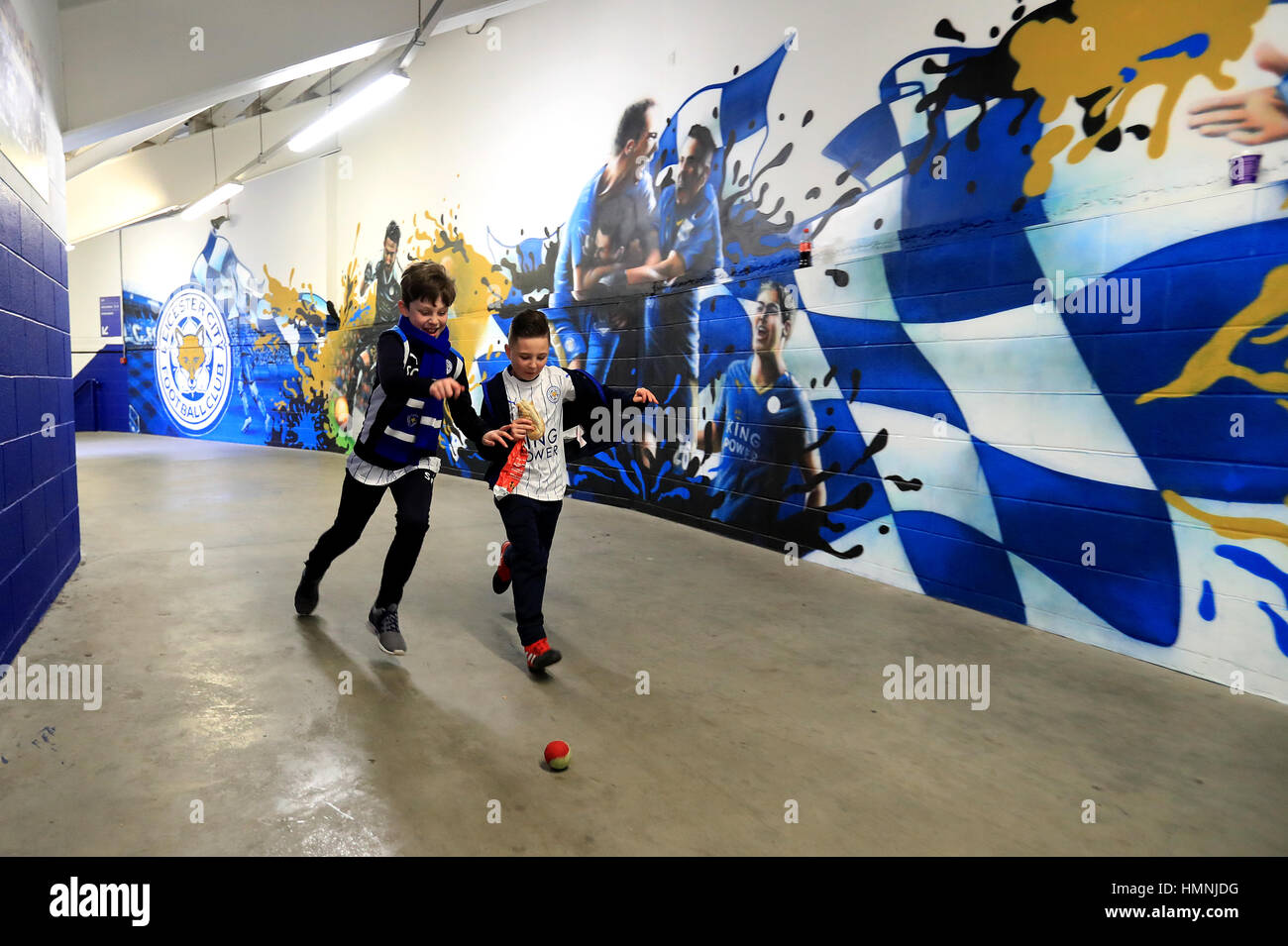 Young Leicester City fans play with a ball before the Premier League match at the King Power Stadium, Leicester. Stock Photo